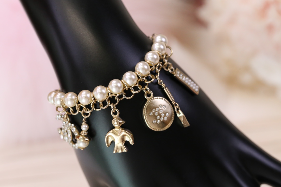 Chanel Bird CC Charms Chain Pearl Tassel Bracelet