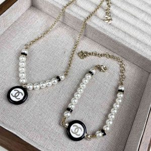 Chanel Black and White Round Charm Pearl Bracelet Necklace