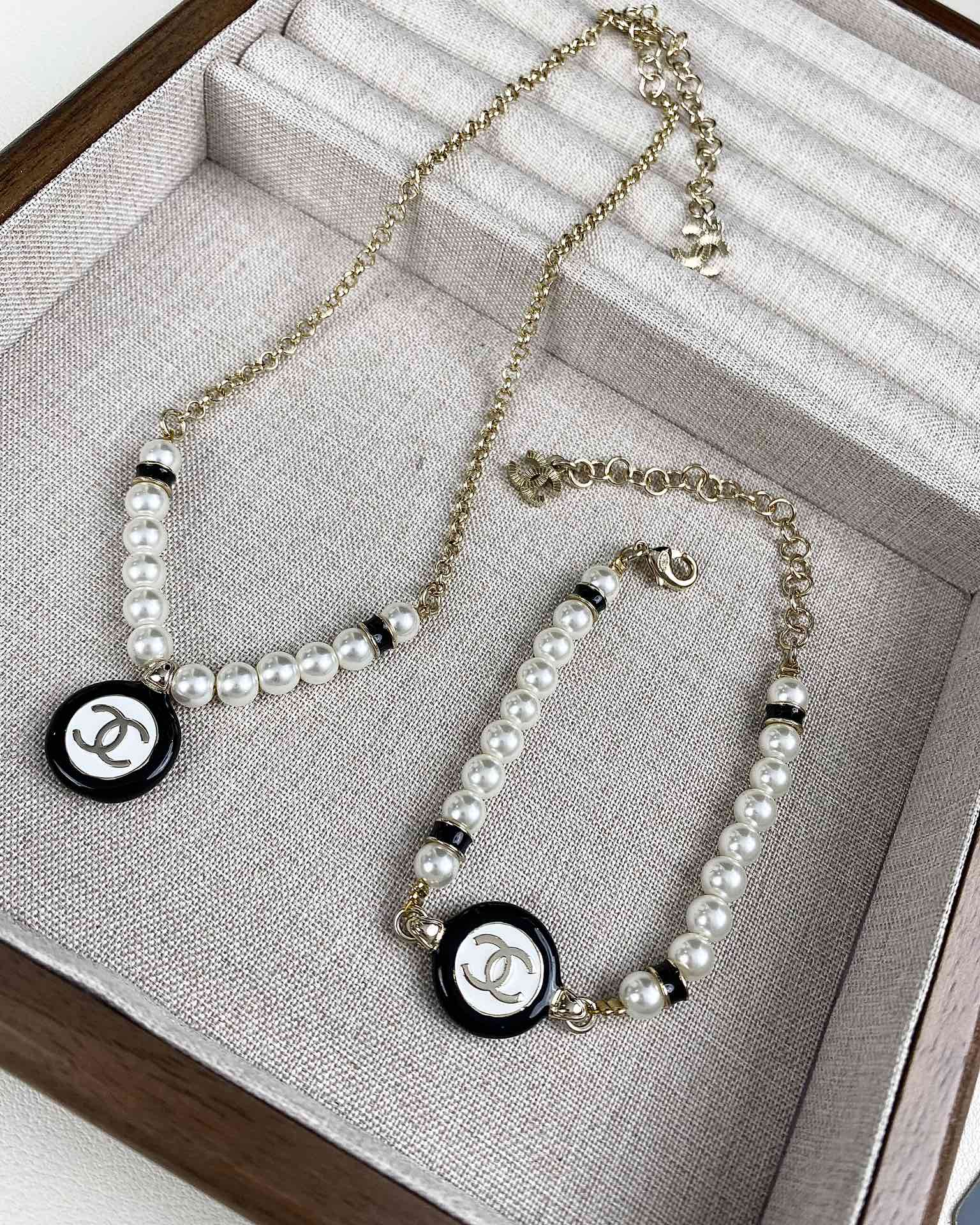 Chanel Black and White Round Charm Pearl Bracelet Necklace